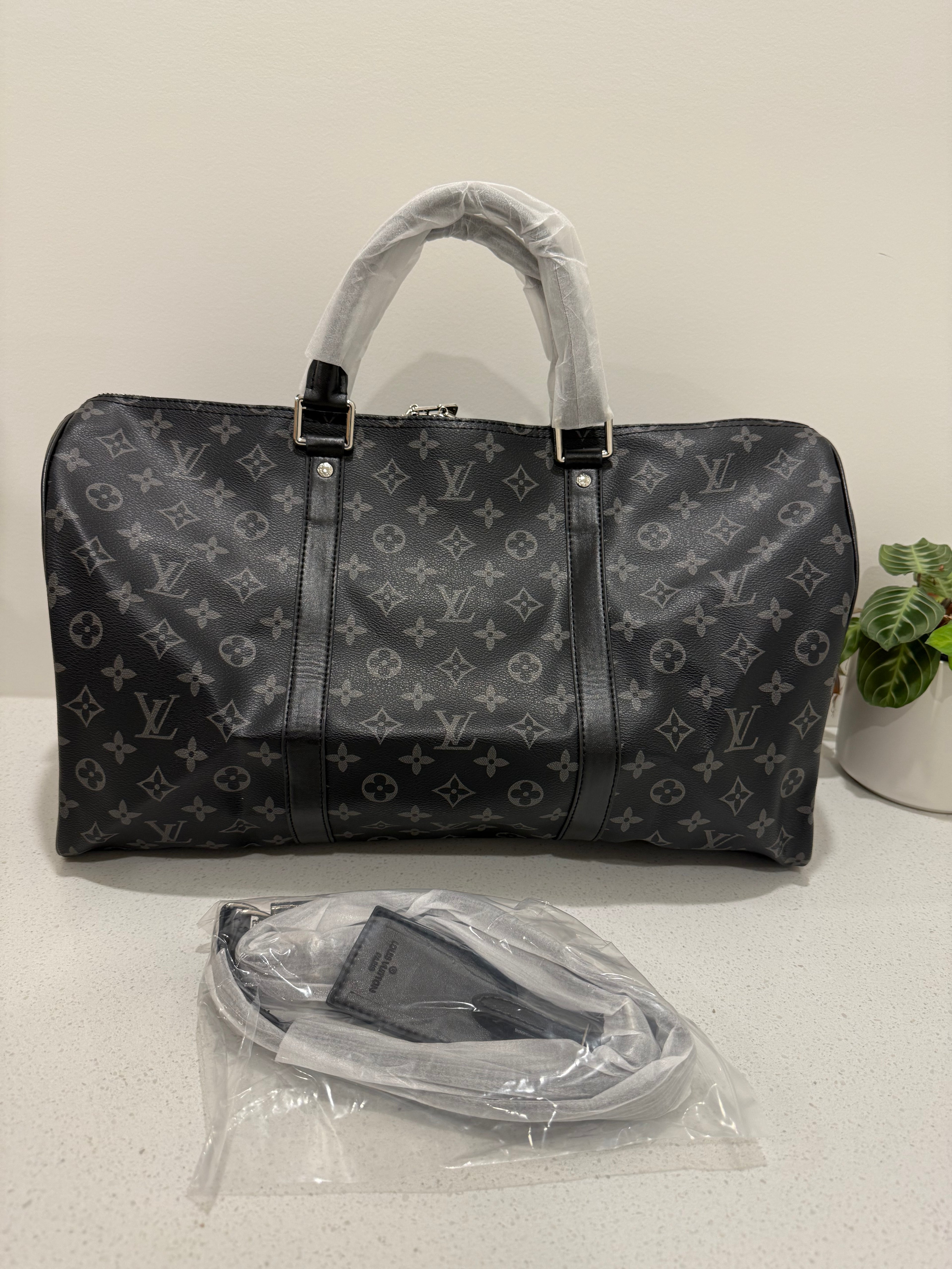Black lv overnight bag